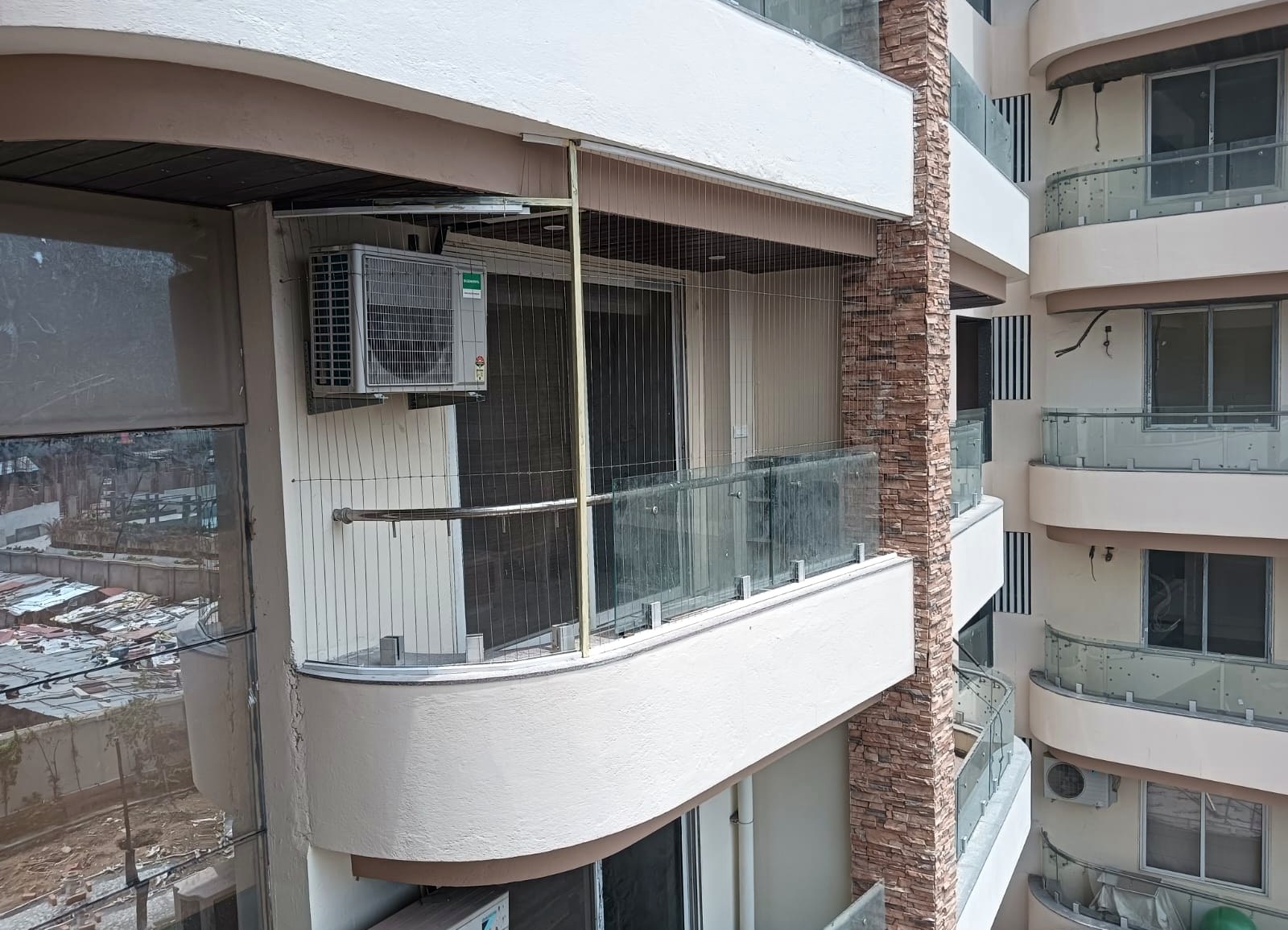 BLGP invisible grill installation on a multi-storey residential building